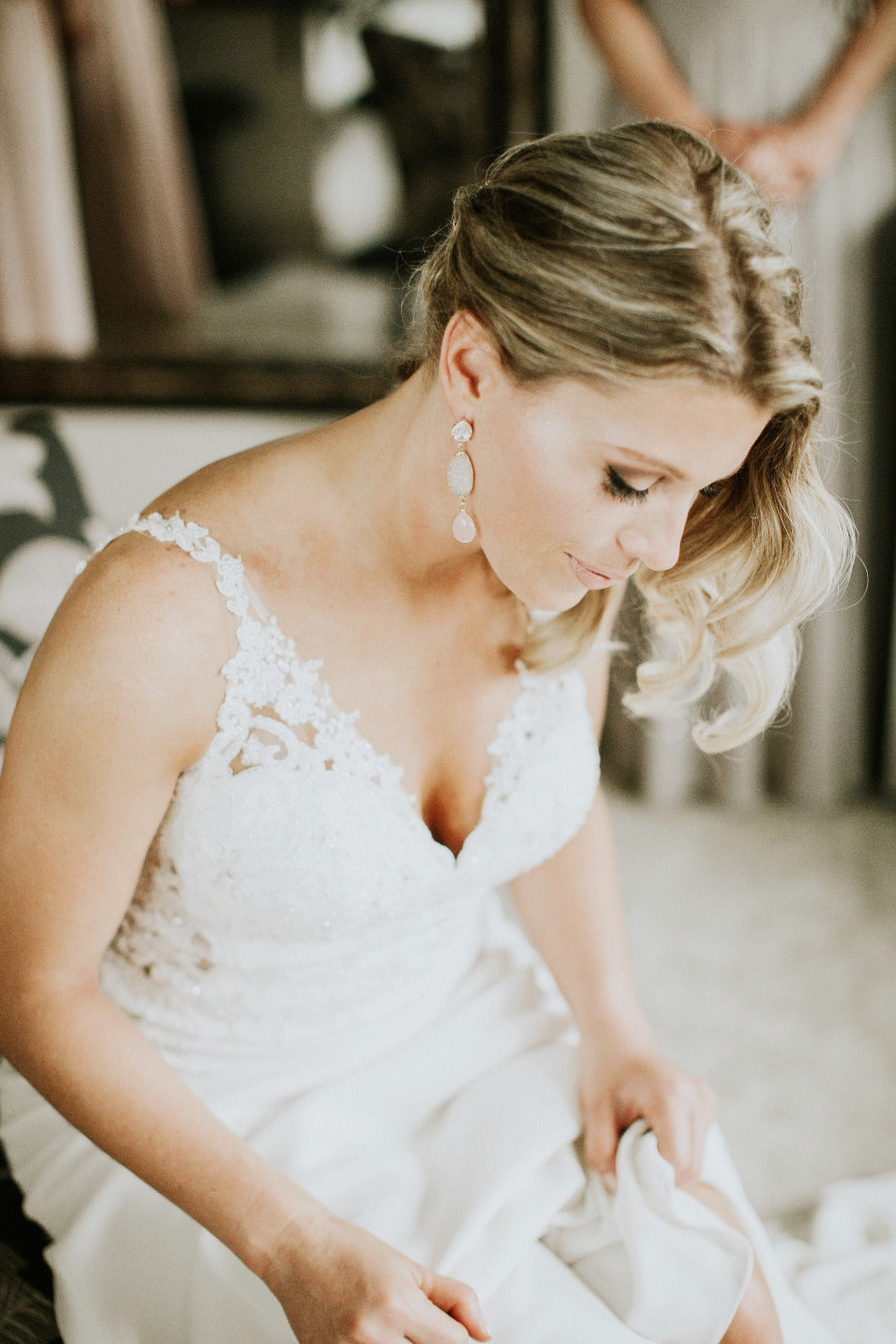 neutral drusy and blush rose quartz statement earrings on a bride