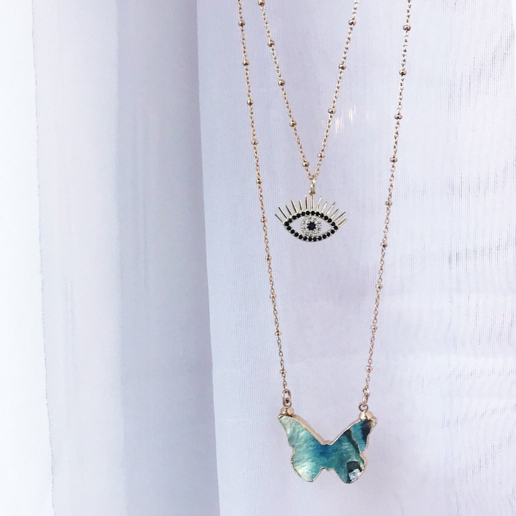 Rachel Mulherin gold and black CZ evil eye necklace with eyelashes