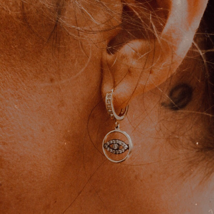 silve and gold CZ evil eye huggie earring