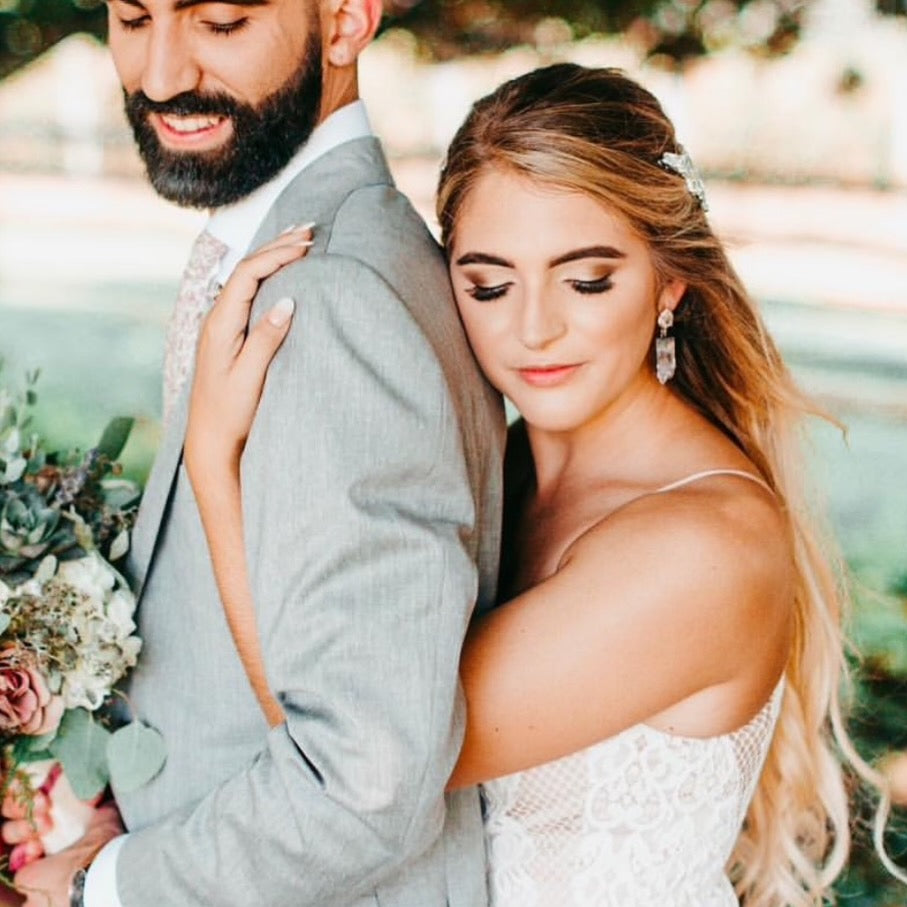 bohemian bride wearing our amethyst statement earrings to her wedding