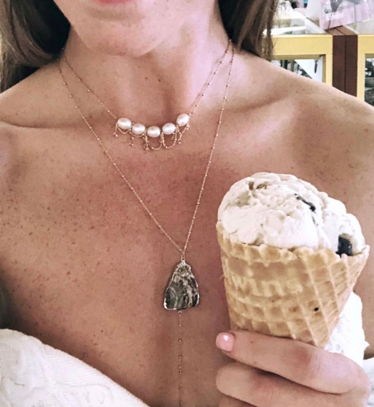 pearl and gold chain alba necklace layered on neck