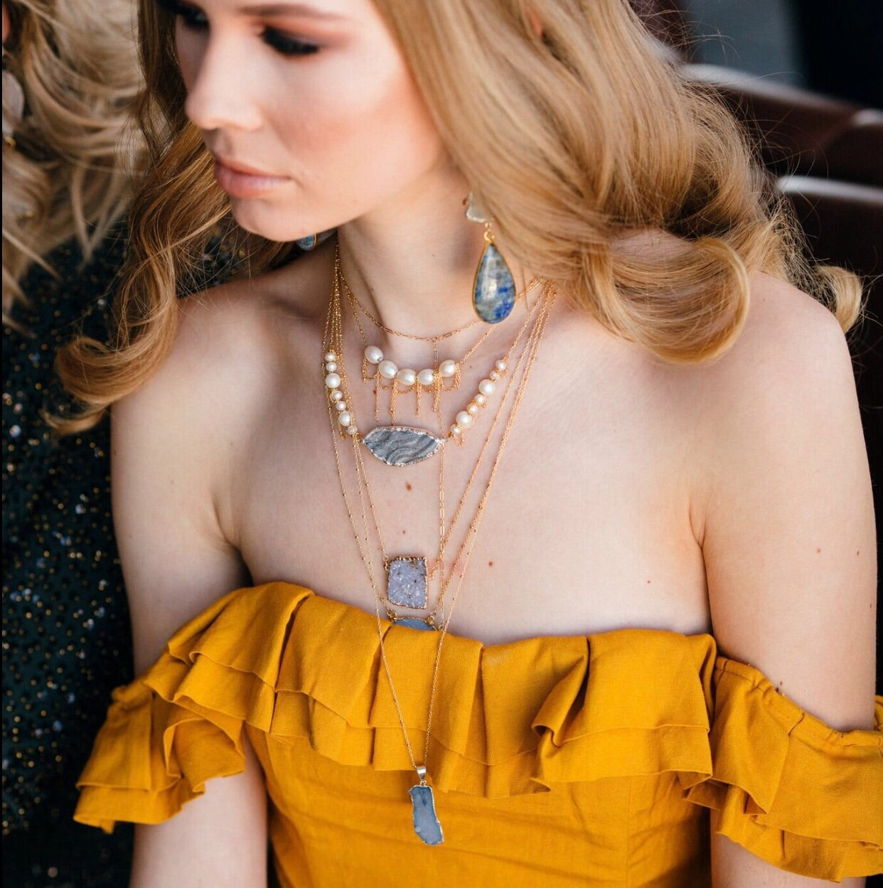 pearl and geode layered necklaces on model