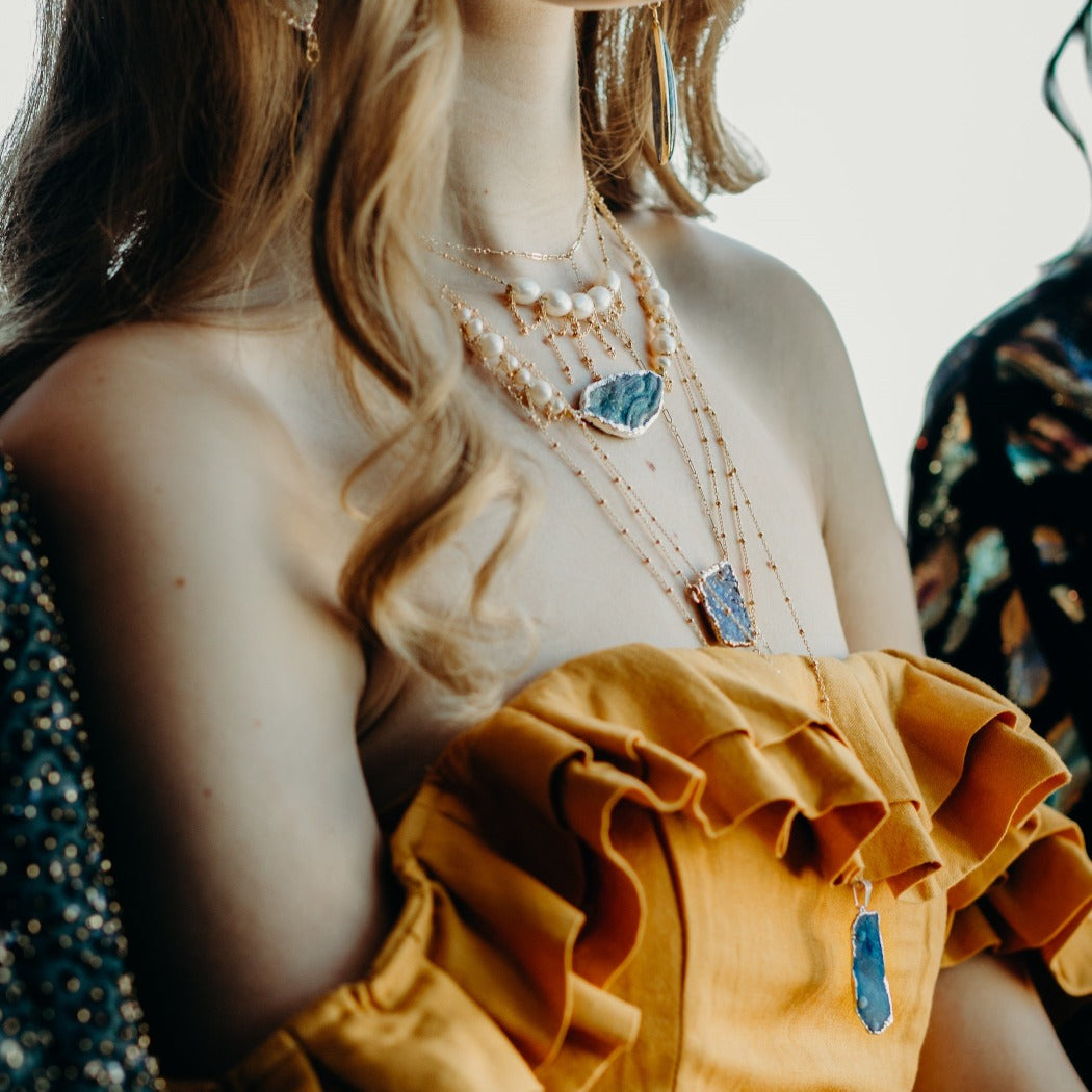 pearl and geode layered necklaces on model in baltimore