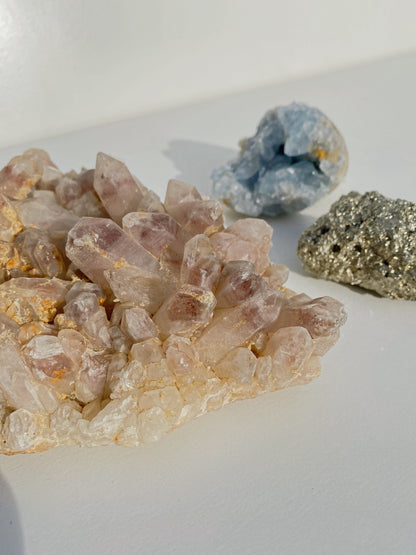 holy glam celestine crystal strawberry quartz and pyrite as home decor
