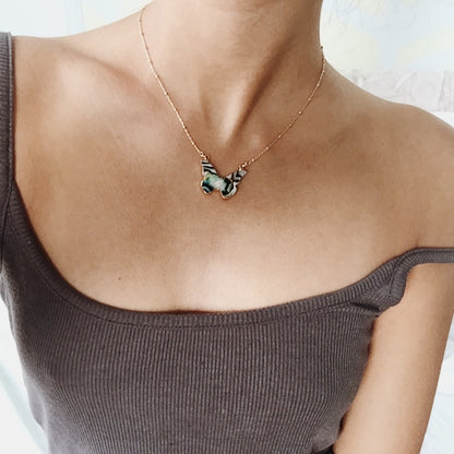 Abalone butterfly necklace in 24kt gold on model neck