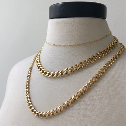 basic gold layered curb chains on neck