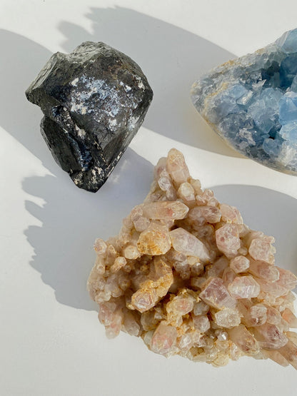 black tourmaline blue celestine and blush strawberry quartz large crystals as home decor