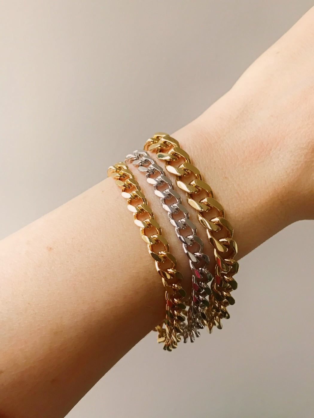 Rachel Mulherin basic gold layered curb chains bracelets on wrist